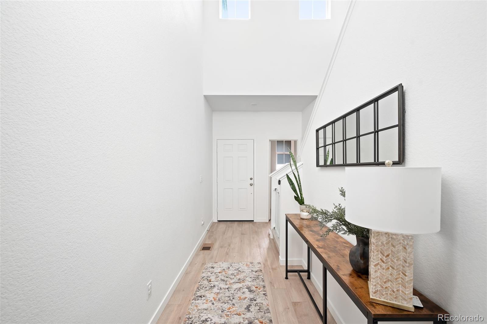16249 Laurentide Place Parker, CO 80134 - Photo 5 of 30 a living room with furniture