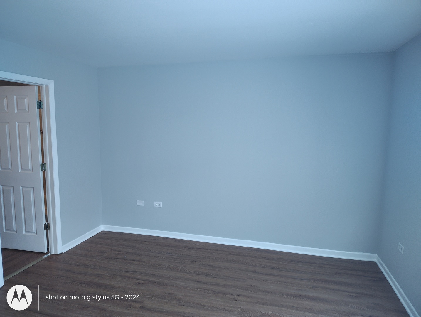 2367 East 70th Place, Unit 1A Chicago, IL 60649 - Photo 21 of 30 a view of an empty room with wooden floor