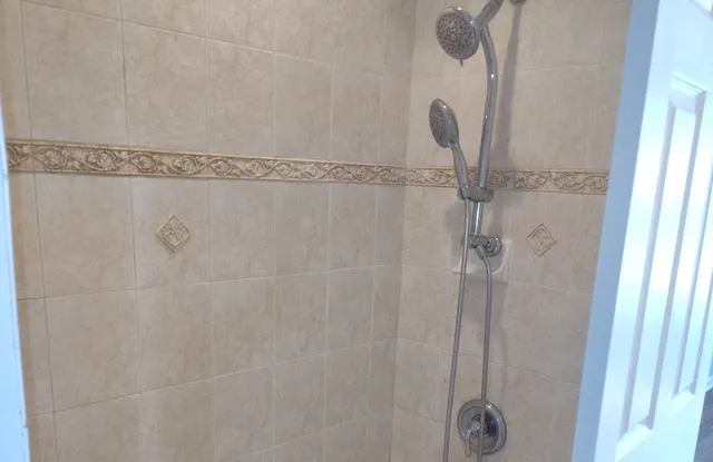 a close view of a shower in bathroom