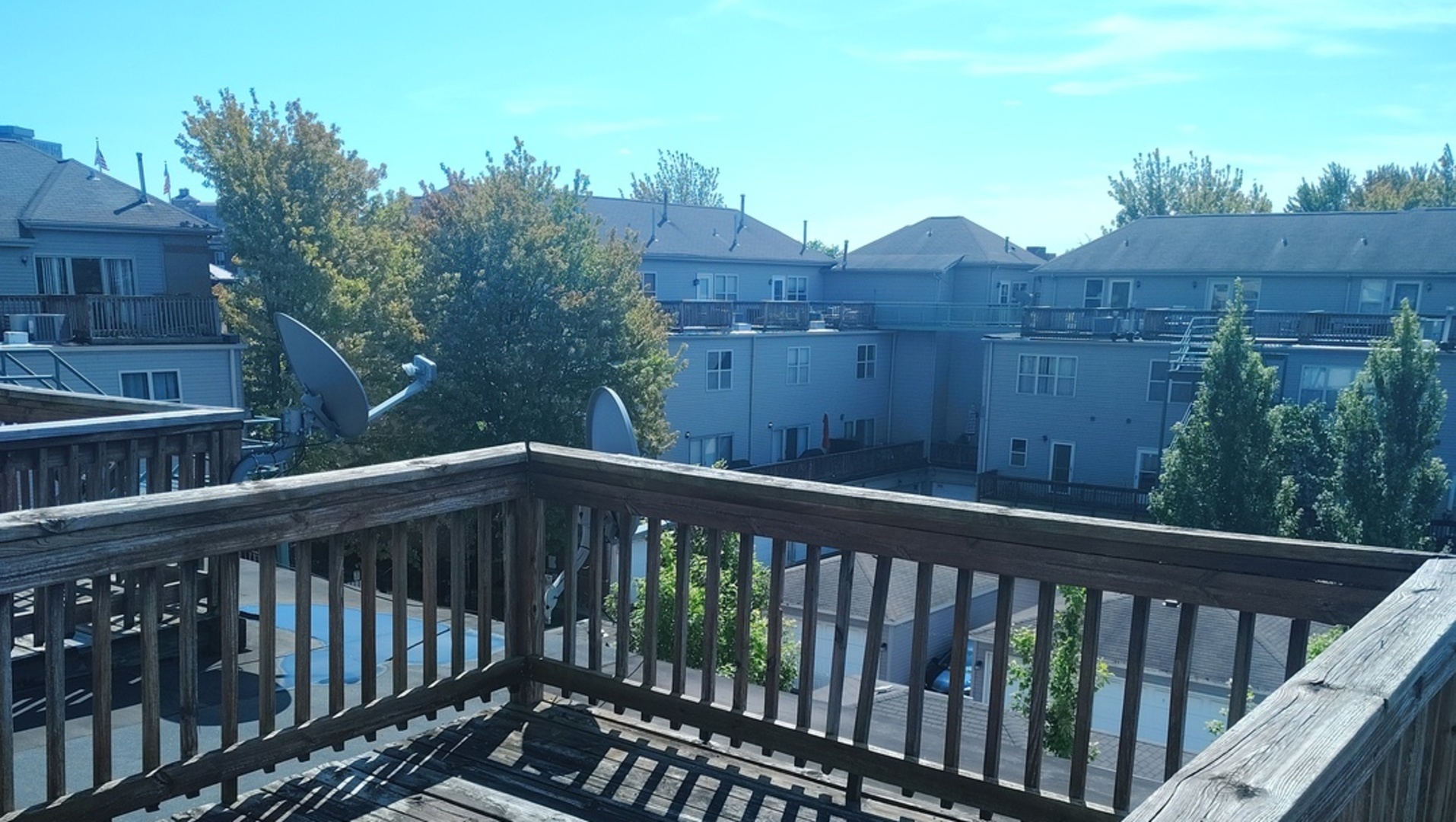 2367 East 70th Place, Unit 1A Chicago, IL 60649 - Photo 27 of 30 a view of a balcony with wooden fence and floor