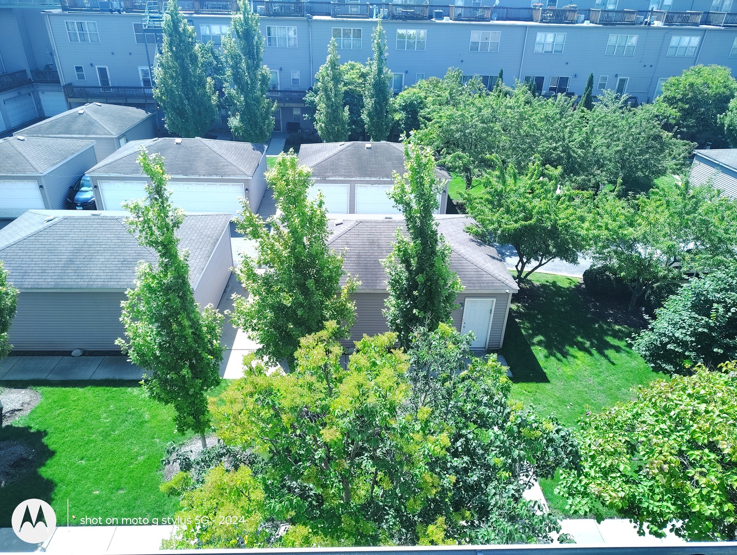 2367 East 70th Place, Unit 1A Chicago, IL 60649 - Photo 29 of 30 an aerial view of a house with a yard and garden in back