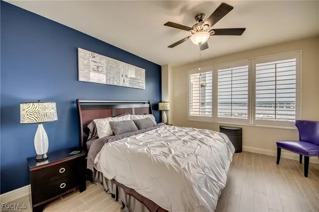 a bed room with a bed and a lamp