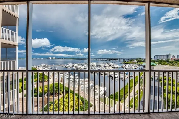 a view of a chairs and table in patio with a small pool