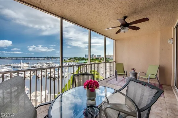 a view of balcony with furniture