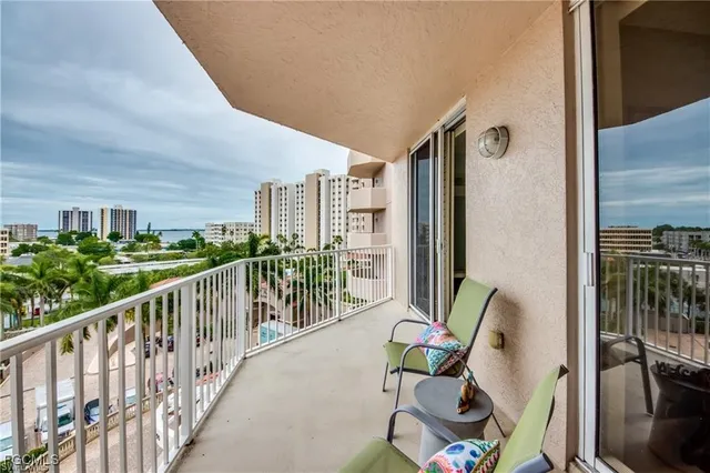 a view of balcony with furniture