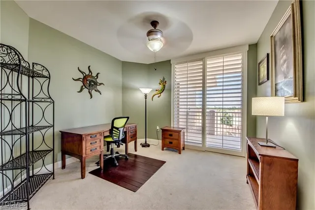 a view of a livingroom with furniture and a window