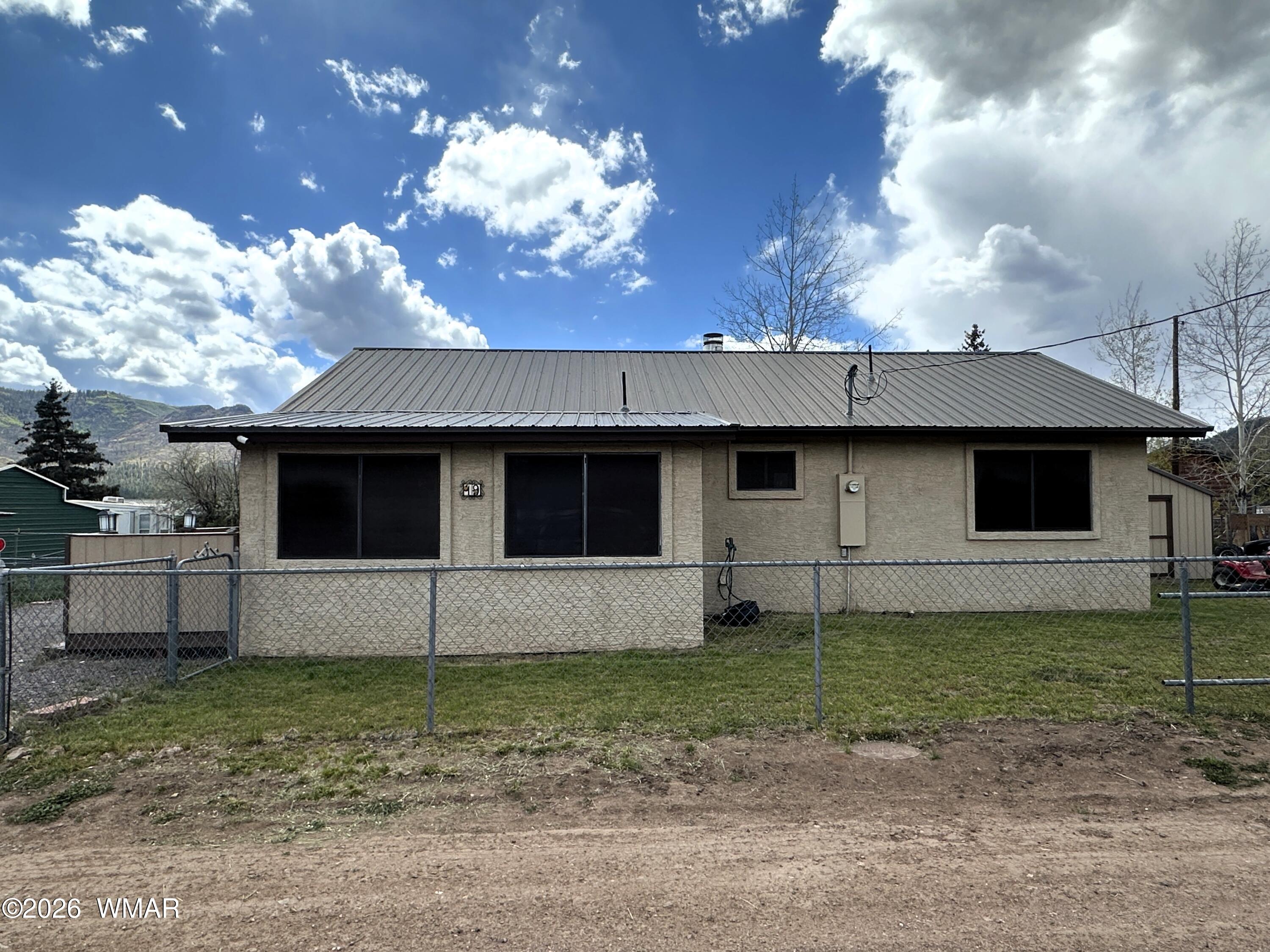 19 County Road Alpine, AZ 85920 - Photo 19 of 27 a view of a house with a yard