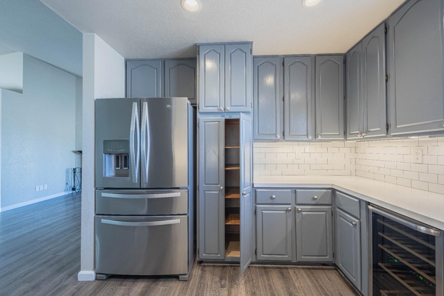 890 Sloat Drive Salinas, CA 93907 - Photo 12 of 37 a kitchen with a refrigerator and cabinets