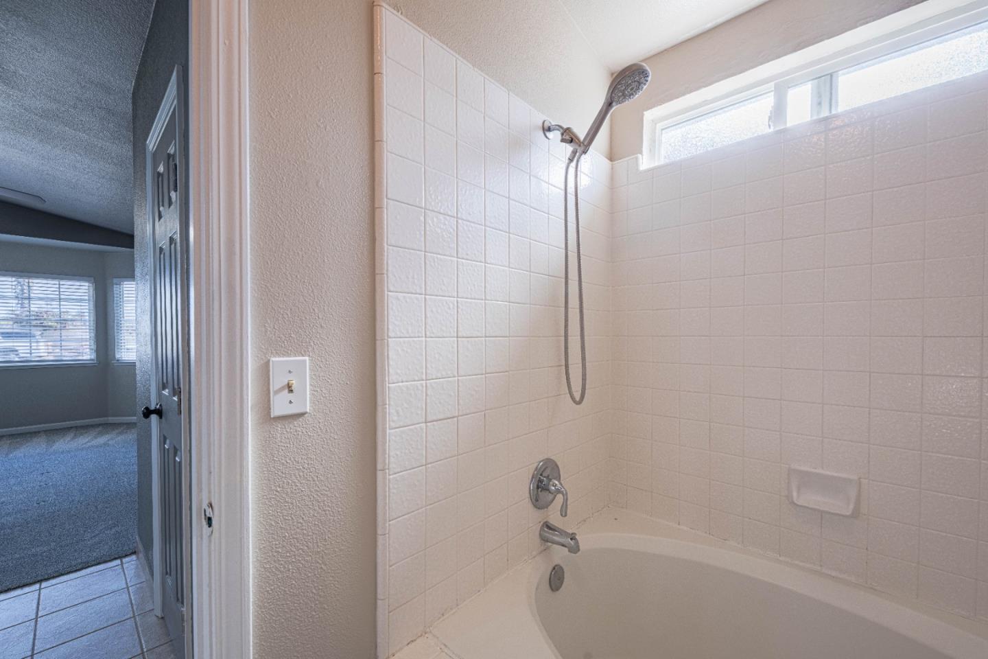 890 Sloat Drive Salinas, CA 93907 - Photo 18 of 37 a bathroom with a shower and a bathtub