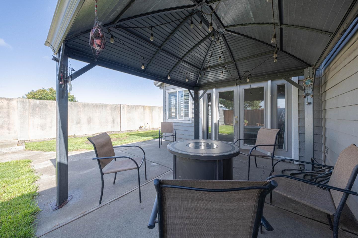 890 Sloat Drive Salinas, CA 93907 - Photo 32 of 37 a view of patio with table and chairs and floor to ceiling window