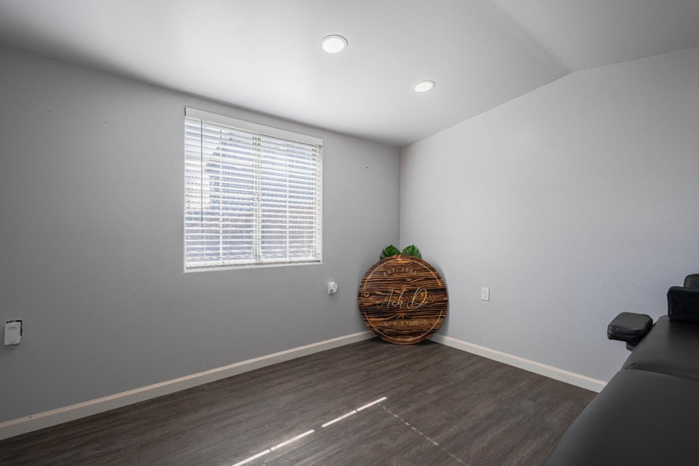 890 Sloat Drive Salinas, CA 93907 - Photo 34 of 37 an empty room with wooden floor and windows