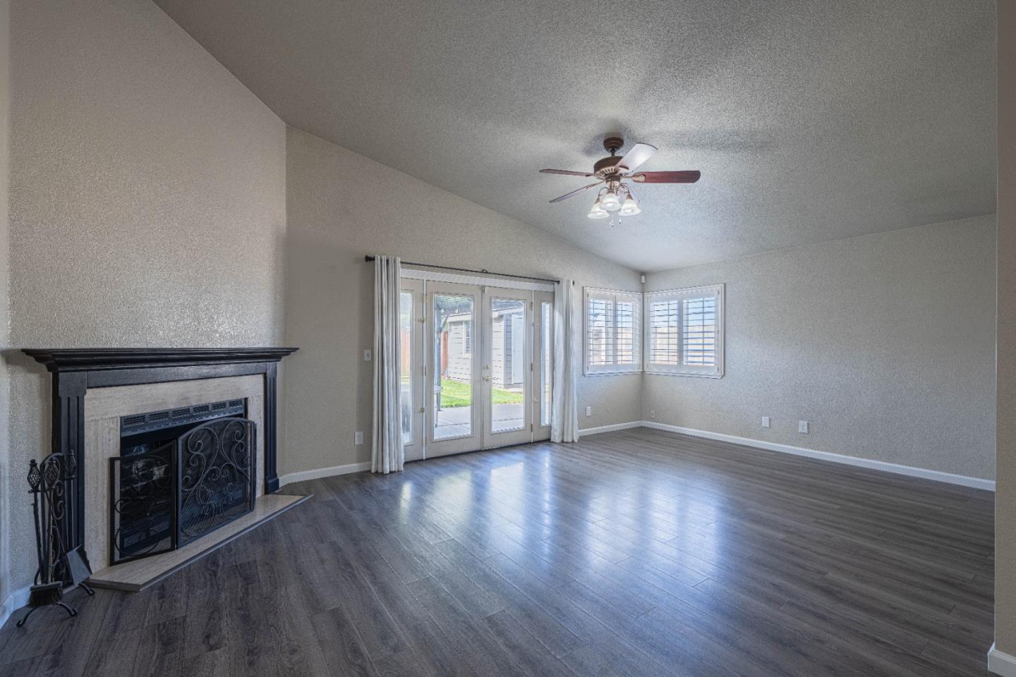 890 Sloat Drive Salinas, CA 93907 - Photo 4 of 37 wooden floor in an empty room with a window