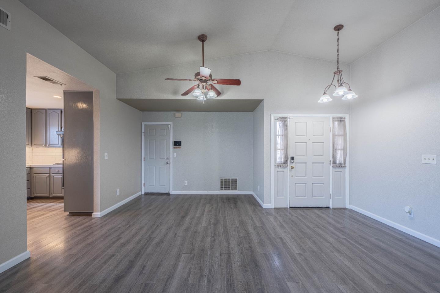 890 Sloat Drive Salinas, CA 93907 - Photo 7 of 37 a view of a room with wooden floor chandelier and entryway