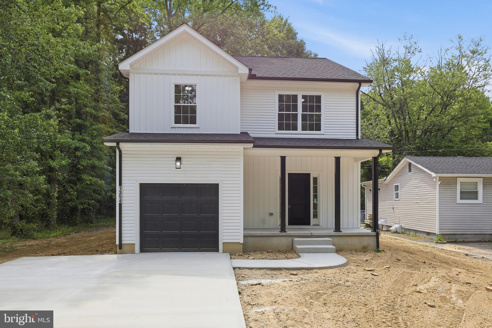 1354 College Road Dover, DE 19904 - Photo 2 of 46 a front view of a house with a yard