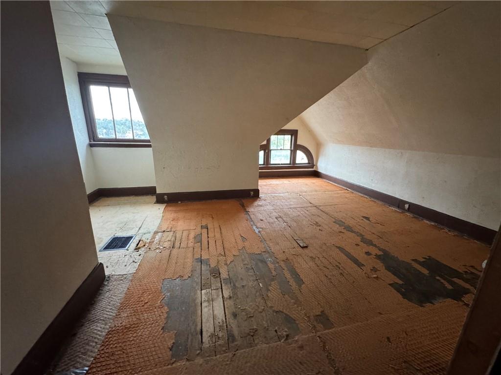 221 Singer Avenue McKees Rocks, PA 15136 - Photo 17 of 23 wooden floor in an empty room with a window