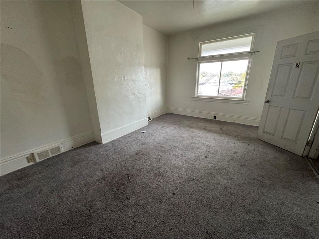 221 Singer Avenue McKees Rocks, PA 15136 - Photo 3 of 23 an empty room with windows