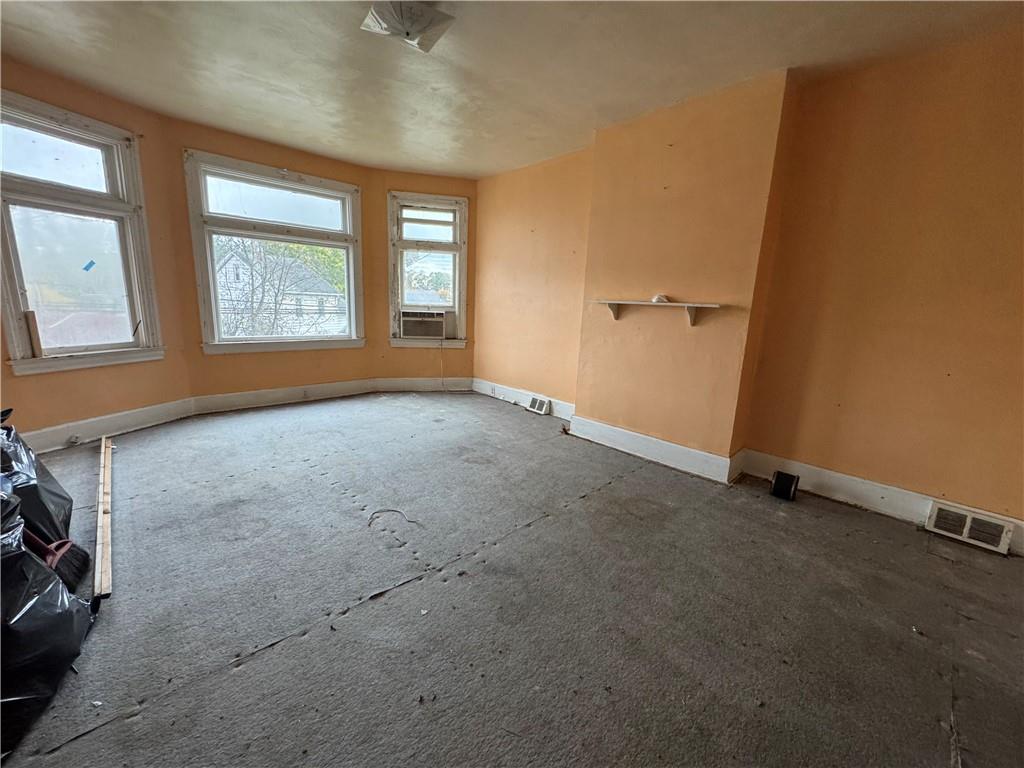 221 Singer Avenue McKees Rocks, PA 15136 - Photo 7 of 23 an empty room with windows