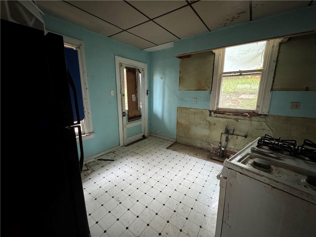 221 Singer Avenue McKees Rocks, PA 15136 - Photo 9 of 23 a kitchen with a sink a refrigerator and window