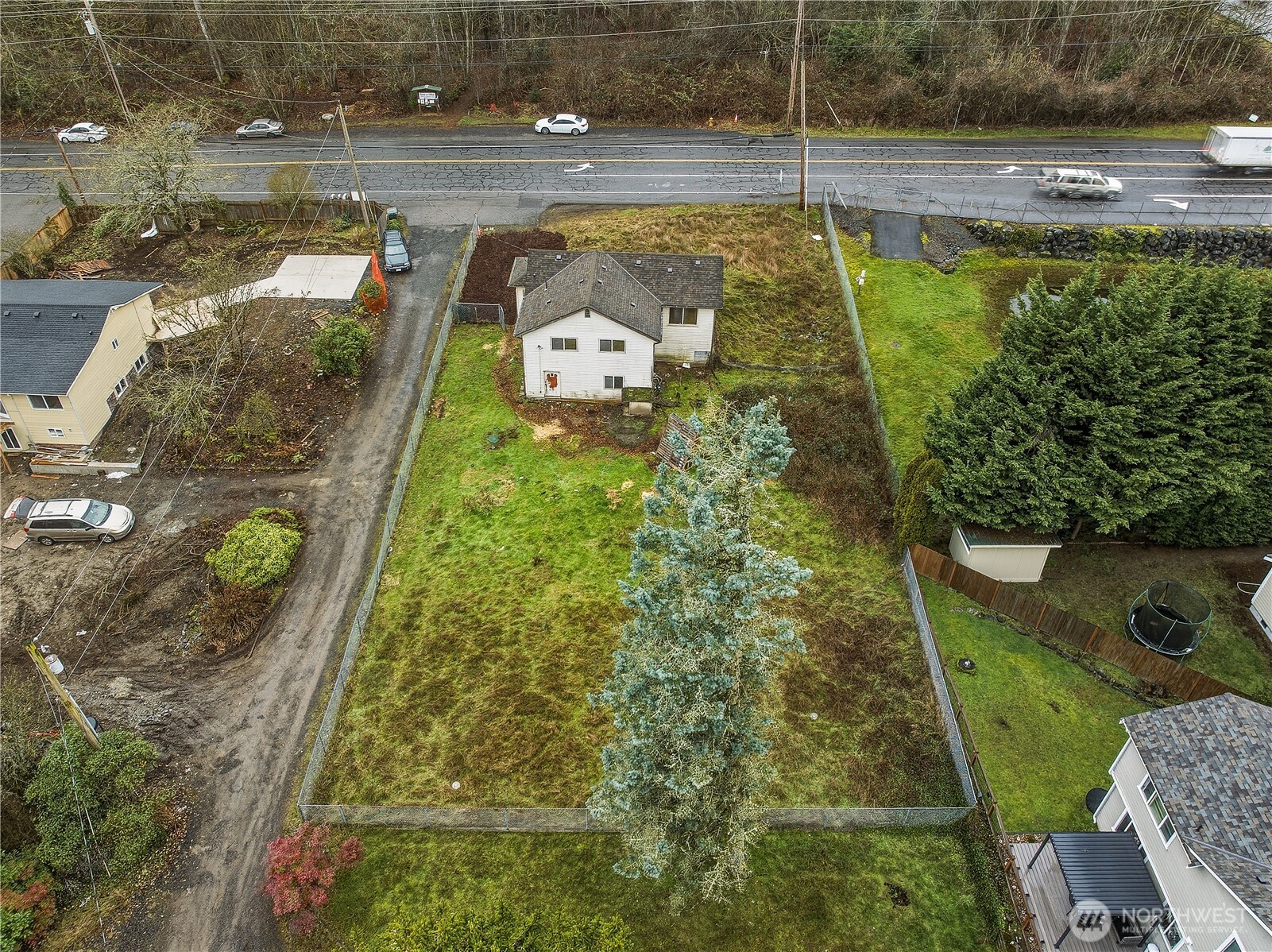 22827 Meridian Avenue South Bothell, WA 98021 - Photo 1 of 27 a view of a swimming pool with a yard
