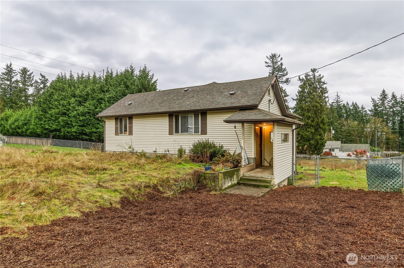 22827 Meridian Avenue South Bothell, WA 98021 - Photo 2 of 27 a front view of a house with garden