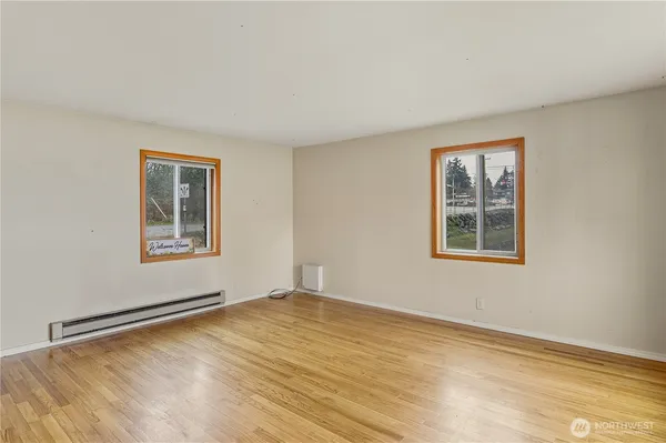 a view of an empty room with a window