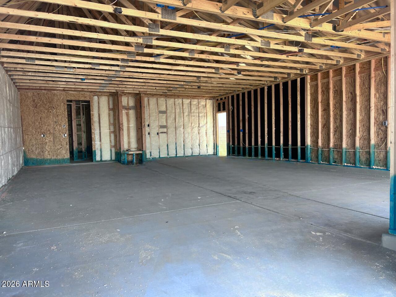 2651 Homesteaders Road San Tan Valley, AZ 85140 - Photo 3 of 17 a view of a building with floor to ceiling windows