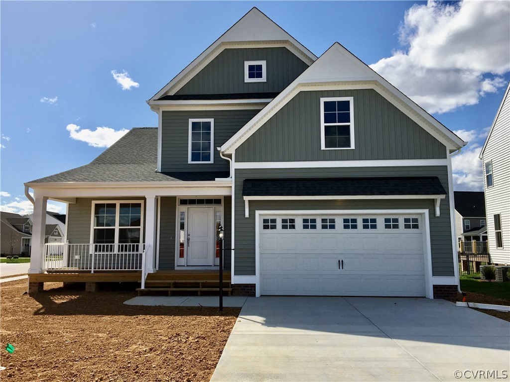 8423 Bishops Park Drive Mechanicsville, VA 23116 - Photo 1 of 17 a front view of a house with a yard