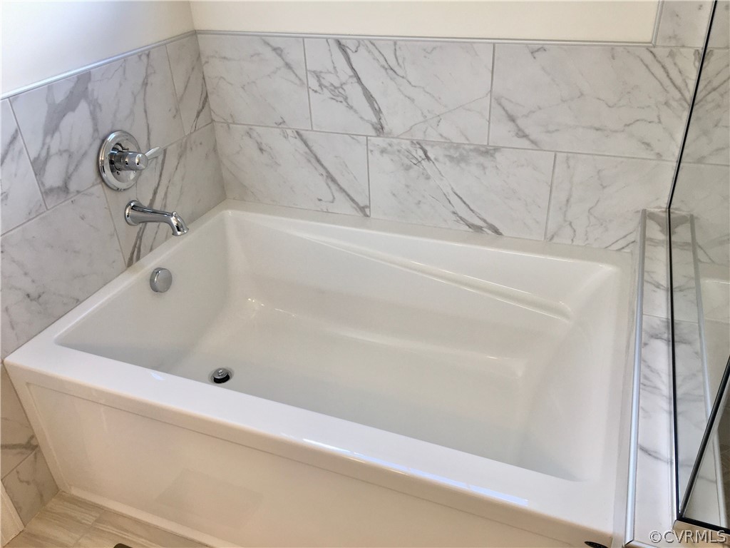 8423 Bishops Park Drive Mechanicsville, VA 23116 - Photo 12 of 17 a bathroom with a bathtub