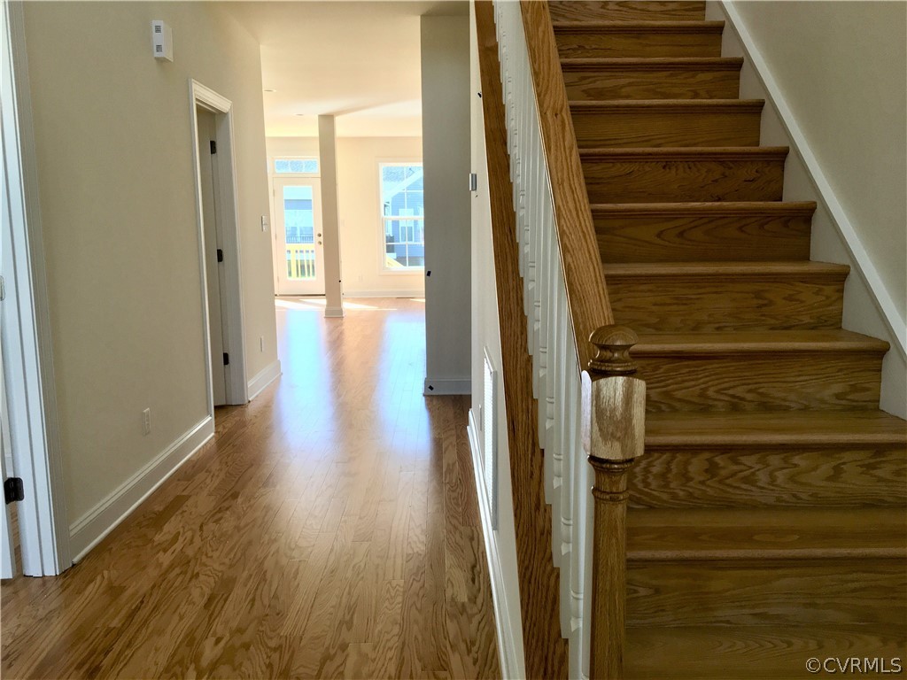 8423 Bishops Park Drive Mechanicsville, VA 23116 - Photo 3 of 17 a view of a hallway with wooden floor and entryway
