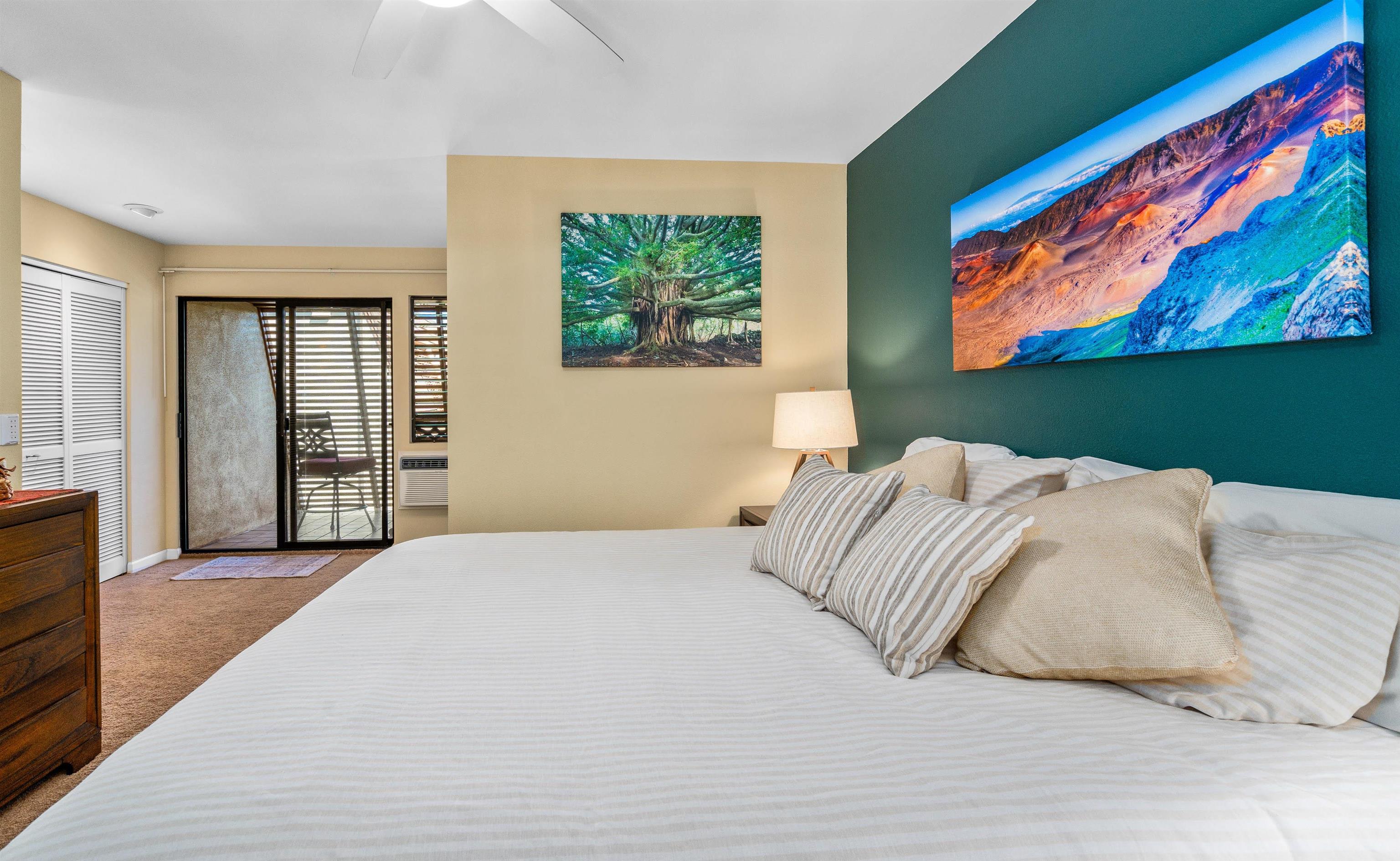 2777 South Kihei Road, Unit G207 Kihei, HI 96753 - Photo 30 of 50 a bedroom with a bed and a painting on the wall