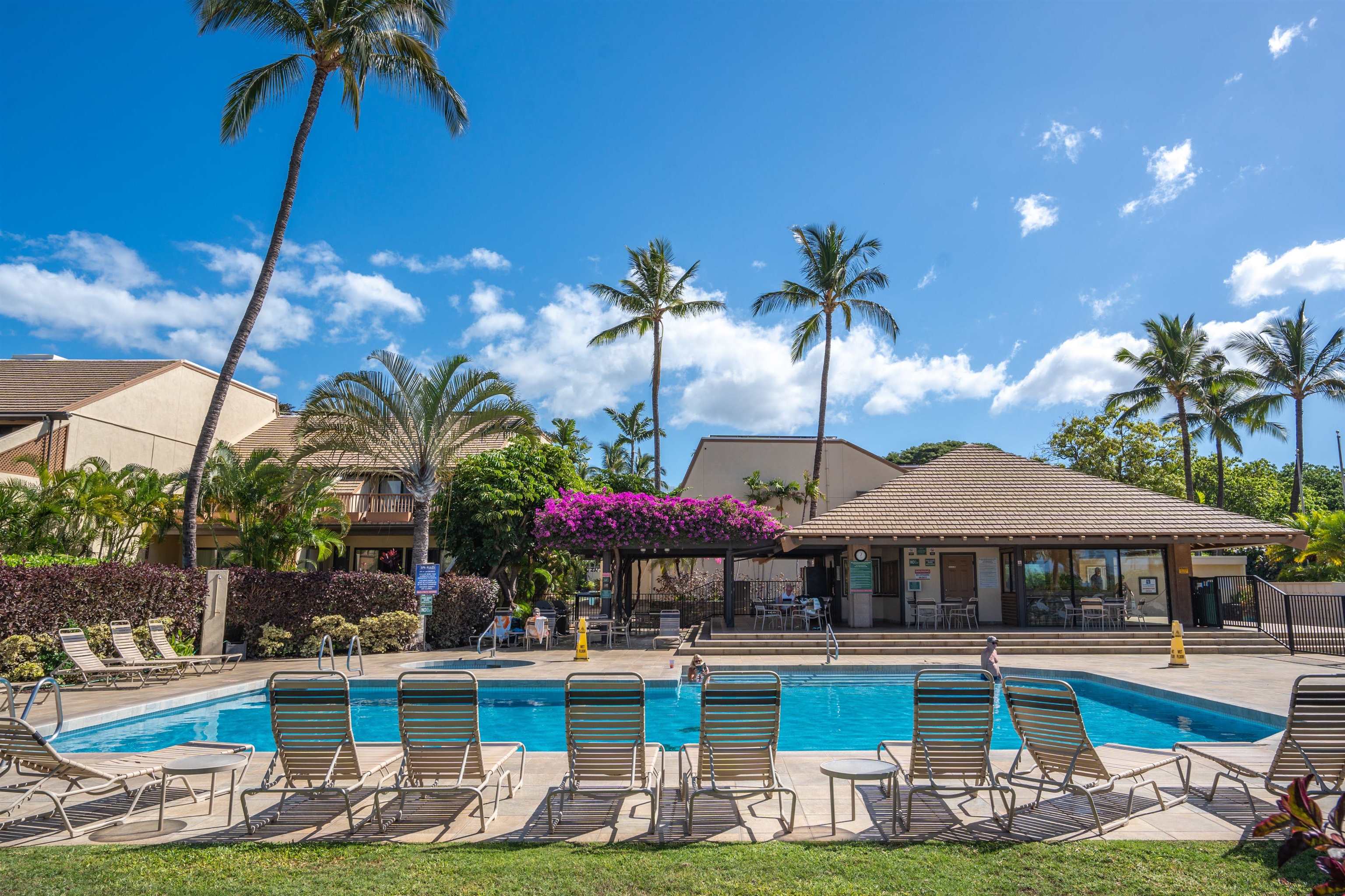2777 South Kihei Road, Unit G207 Kihei, HI 96753 - Photo 43 of 50 a view of a swimming pool with lawn chairs under an umbrella