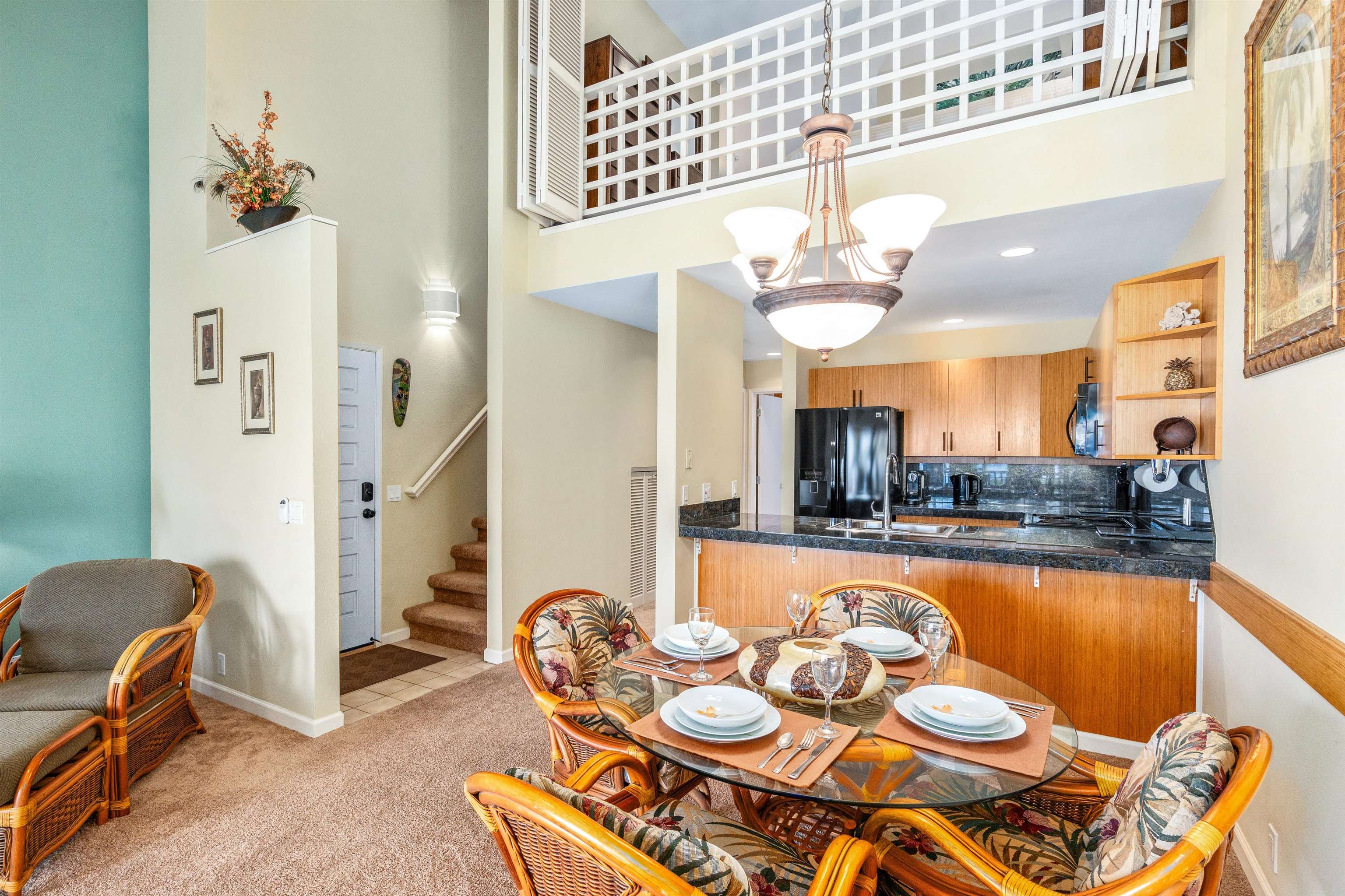 2777 South Kihei Road, Unit G207 Kihei, HI 96753 - Photo 8 of 50 a view of a dining room and livingroom with furniture wooden floor a chandelier