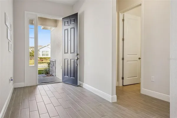 a living room with furniture and a ceiling fan