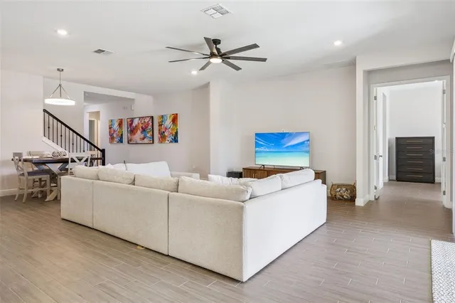 a vase of flowers sitting on a table with window