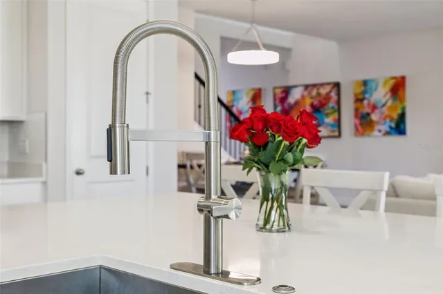 a bathroom with a double vanity sink a toilet and a bathtub