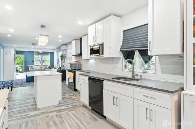 a kitchen with a sink cabinets and window