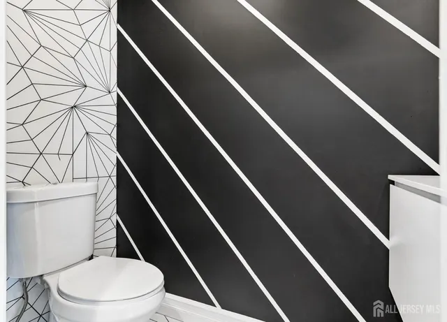 a bathroom with a toilet and a bathtub