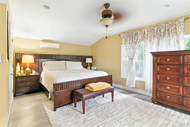 a bedroom with a bed and a dresser