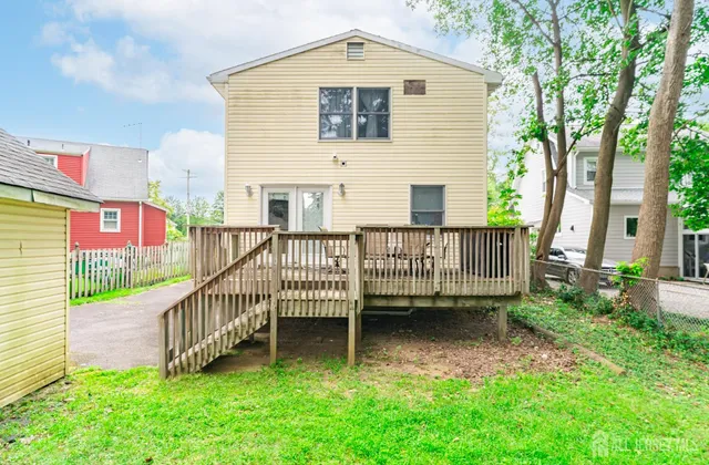 a view of a house with a yard and a porch
