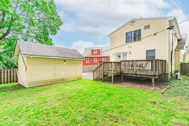 a view of a backyard with a small cabin