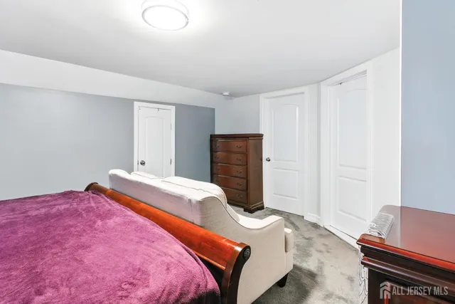 a bedroom with a bed and a desk