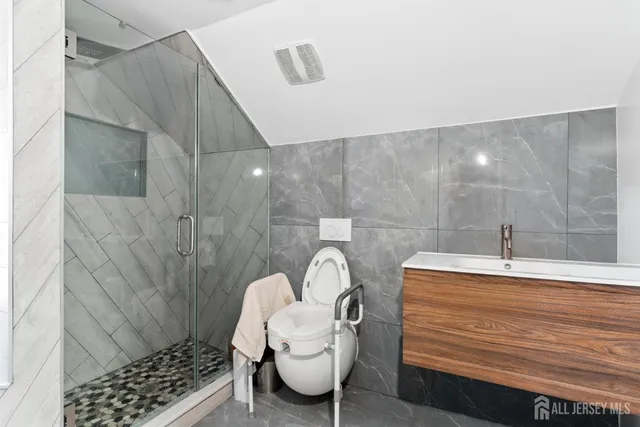 a bathroom with a sink and a shower