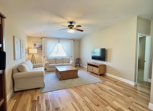 a living room with furniture and a rug
