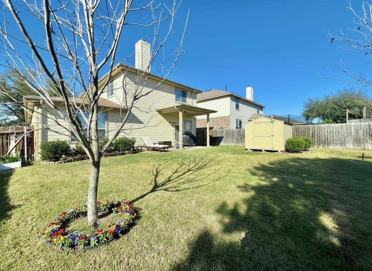 17705 Mahonia Lane Elgin, TX 78621 - Photo 30 of 35 a front view of a house with garden