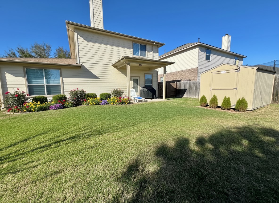 17705 Mahonia Lane Elgin, TX 78621 - Photo 31 of 35 Big backyard with covered patio and storage shed. Virtually staged with additional plants and flowers.
