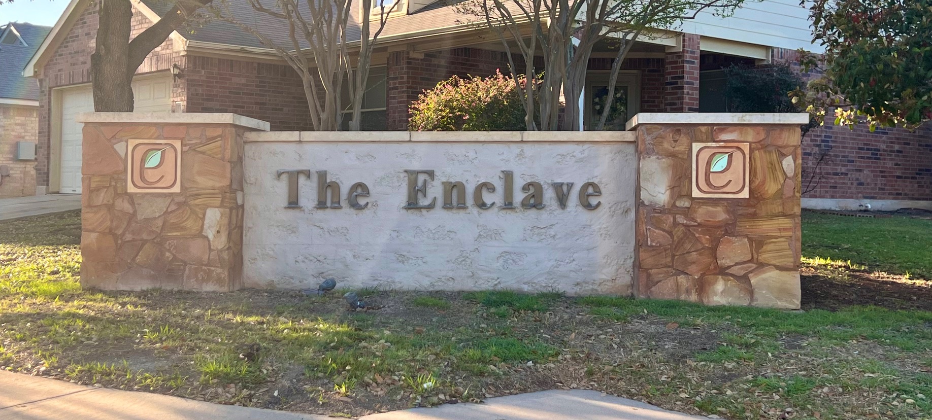 17705 Mahonia Lane Elgin, TX 78621 - Photo 33 of 35 a street sign that is on a brick wall
