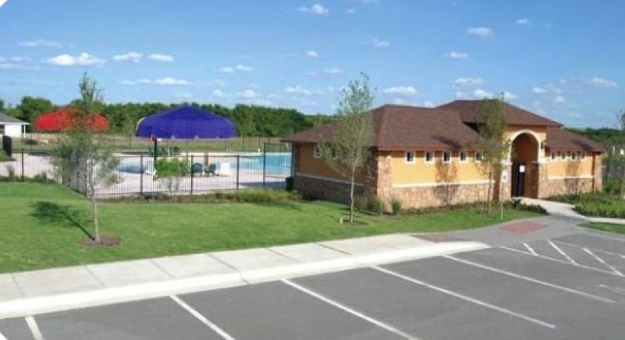 17705 Mahonia Lane Elgin, TX 78621 - Photo 34 of 35 a view of a house with a yard and a garden