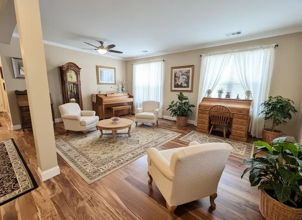 a living room with furniture and a window