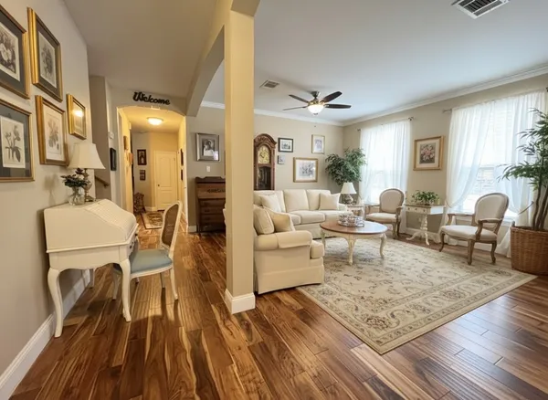 a living room with furniture and a rug