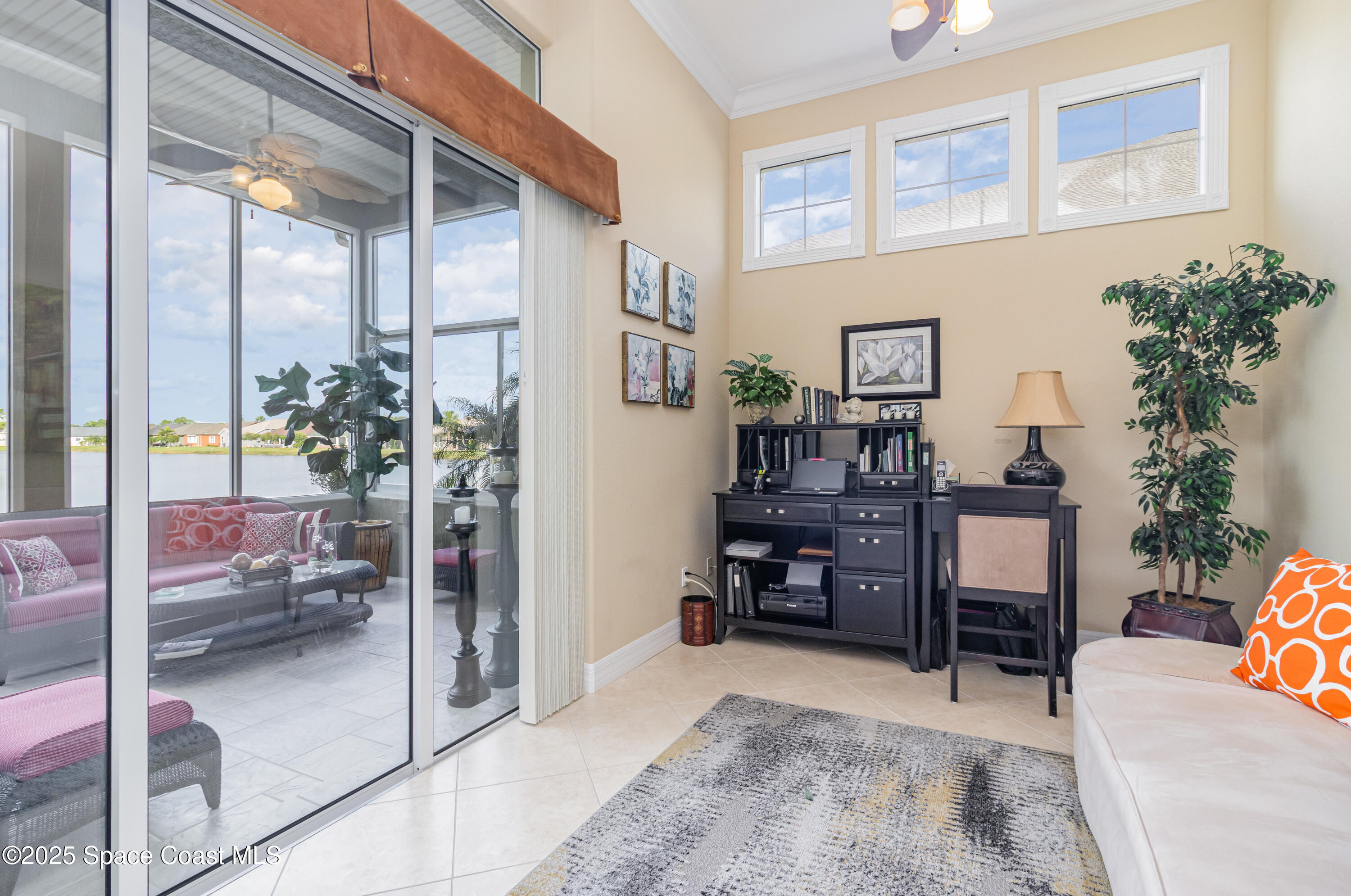 200 Harmony Lane Titusville, FL 32780 - Photo 15 of 28 a living room filled with furniture and a potted plant